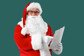 Santa Claus with letters on green background