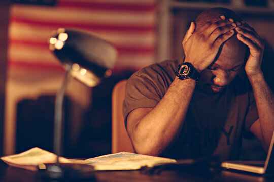 American soldier being tired and missing home while being deployed in an army base