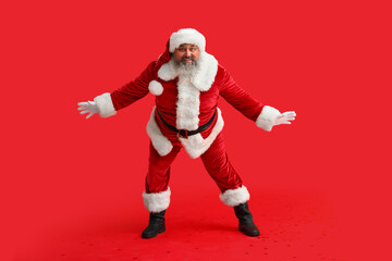 Dancing Santa Claus on red background