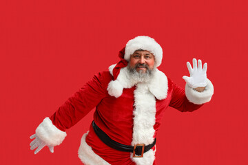 Dancing Santa Claus on red background