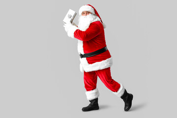 Dancing Santa Claus on grey background