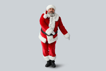 Dancing Santa Claus on grey background