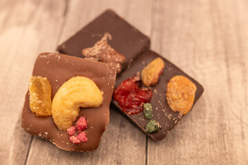 Fototapeta na wymiar handmade chocolates made with chocolate, nuts and sugared fruit