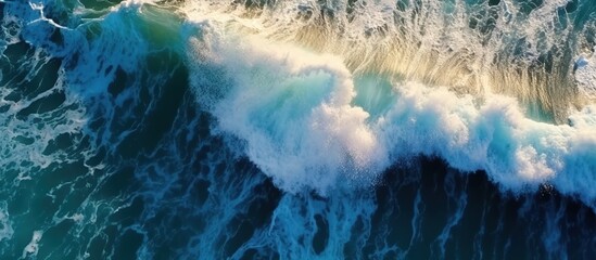 Beautiful texture of big power dark ocean waves with white wash. Aerial top view footage of fabulous sea tide on a stormy day. Drone filming breaking surf with foam in Indian ocean. Big swell in Bali. - obrazy, fototapety, plakaty