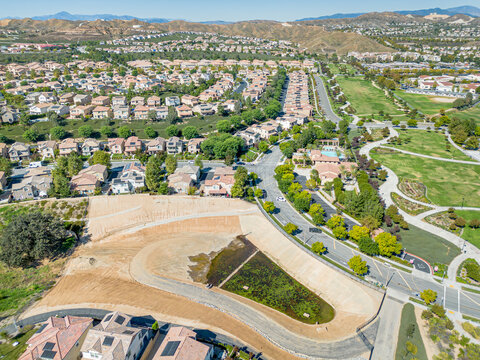 Valencia, California - October 24, 2023: aerial drone photo view toward West Creek Park with swimming pool 
