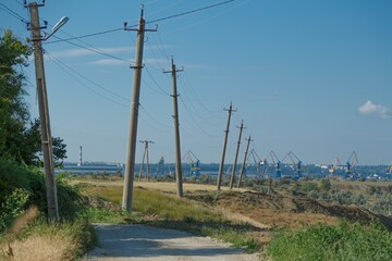 High voltage tower construction on landscape background