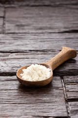Hydrolyzed collagen protein in spoon - Rustic wooden background
