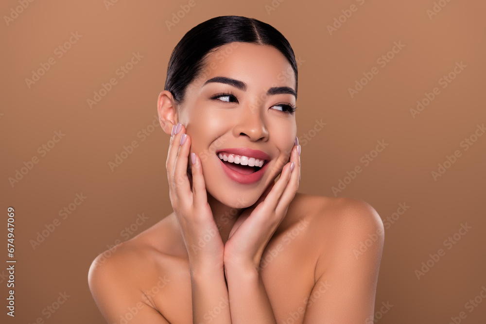 Wall mural Portrait of positive lady touch cheeks enjoy cleansing collagen procedure space isolated on beige color background