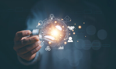 Business global internet connection application technology and digital marketing, Hand holding light bulb with innovation icon network connection, Financial and banking, Digital link tech, Big data.