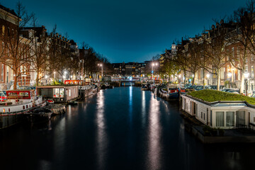 Captivating Night in Amsterdam: A Mesmerizing Long Exposure Photo of Amsterdam's Nighttime Canals.