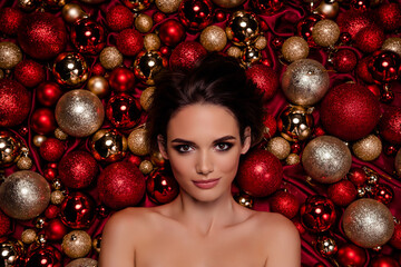 Top view photo of attractive girl enjoy christmas spa salon offer enjoy smooth skin procedure lying on tree toys