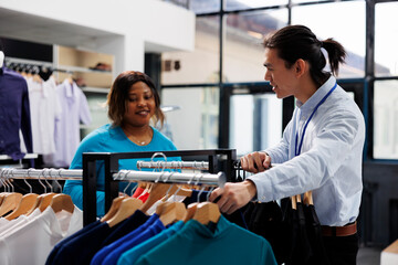 African american customer looking at casual wear, shopping for stylish merchandise in modern...