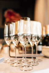 Champagne glasses standing on a table, festive atmosphere, luxurious decor event