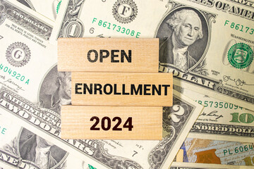 open enrollment 2024. text on a sticker next to money and banknotes. - obrazy, fototapety, plakaty