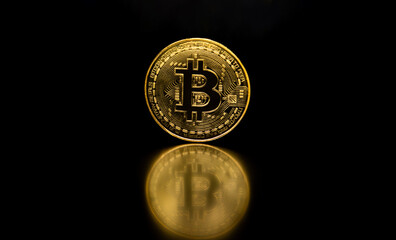 An isolated golden coin Bitcoin symbol on black background