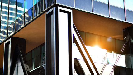 Steel and glass. The subject of modern architecture or construction industry. Modern office building facade with tall steel construction elements and full height windows between. 
 - obrazy, fototapety, plakaty