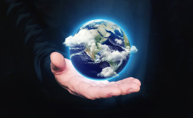 Man hold in hand Earth planet with clouds. Concept of saving the world, protecting the environment. Communication relationships.