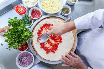 Chef table making craft pizza top view
