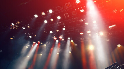 stage lights during the show, concert atmosphere with spotlights and Stage mist