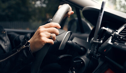 Hands On A Steer Wheel, Woman Driving City Car - obrazy, fototapety, plakaty
