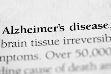 Fototapeta premium Alzheimer's disease, medical disorder terminology printed in black on white paper close-up. medical treatment and therapy found in aged or elderly