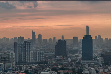 Fototapeta premium Bangkok downtown cityscape with skyscrapers at evening give the city a modern style. No focus, specifically.