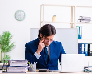 Young businessman sitting and working in the office