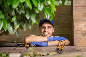 Worker performs the installation of pumping equipment. Sewer cleaning