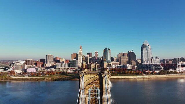 Aerial footage of The John A. Roebling Bridge coming Covington, Kentucky, looking at downtown Cincinnati, Ohio.