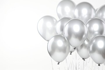 Reflective metallic balloons gathered closely, shimmering under soft light. Celebration accessories. - obrazy, fototapety, plakaty