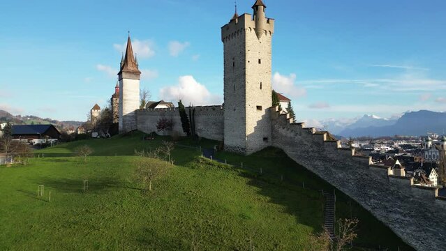 Drone shot over Museggmauer wall with old towers in Lucerne, Switzerland