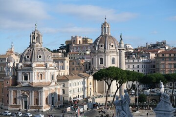 View of Santa Maria di Loreto and Santissimo Nome di Maria church and Trajan Column in Rome, Italy