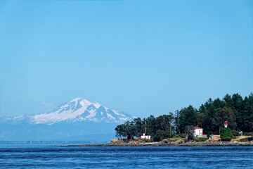 Active Pass Lighthouse with Mount Baker, Mayne Island, BC Canada.