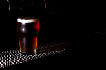 Beer pint close up black background