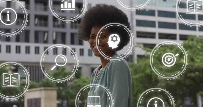 Animation of business icons over african american woman in icty