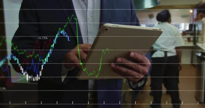 Animation of financial data processing over biracial businessman using tablet