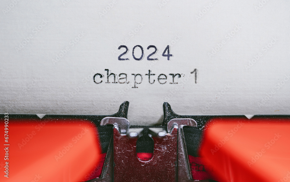 Poster old typewriter with following text on paper - 2024 chapter one. new years concept