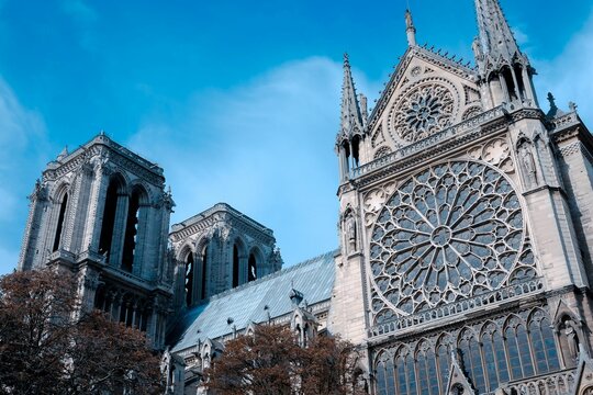 Notre Dame de Paris cathedral, located in France, stands majestically against a clear blue sky