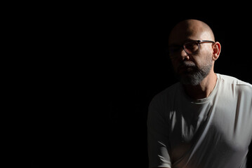 Fototapeta premium Bald, bearded man wearing casual clothes