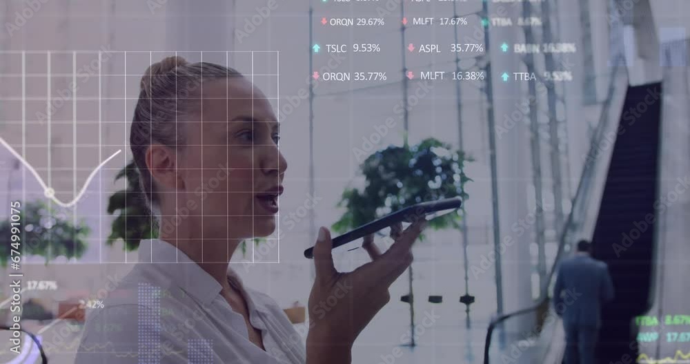 Wall mural Animation of stock market data processing over caucasian woman talking on smartphone at office