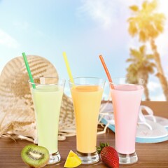 Tasty fruits  and juice with vitamins on background