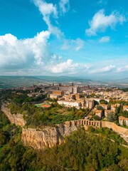 Aerial view of the Italian city of Orvieto, located on a lush green hillside