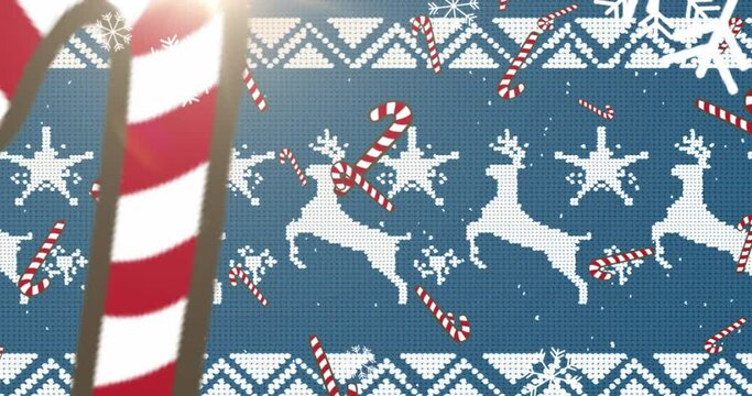 Animation of candy cane, snowflakes falling against christmas traditional pattern on blue background