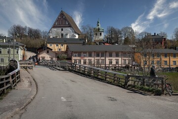 Naklejka premium a view from the road near a small bridge leading to a big church