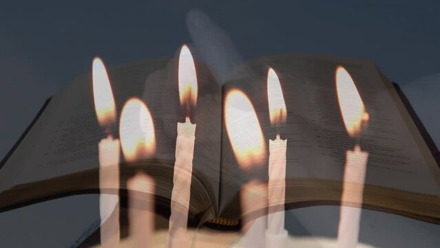 Composite video of burning candles over woman hands with rosary praying against open bible
