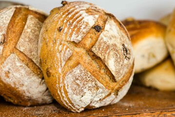 Selection of freshly-baked breads on a rustic wooden table