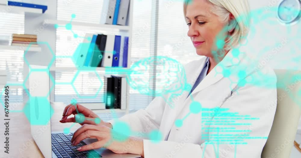 Wall mural Animation of medical data processing over caucasian female senior doctor using laptop at hospital