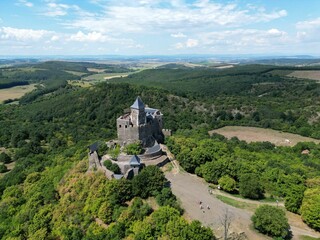 Aerial view of the historic Holloko castle atop a mountain in Hungary