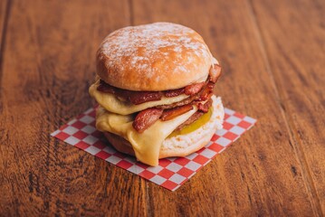 Closeup shot of an appetizing burger with bacon and cheese.