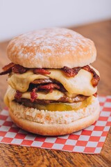 Closeup shot of an appetizing burger with bacon and cheese.